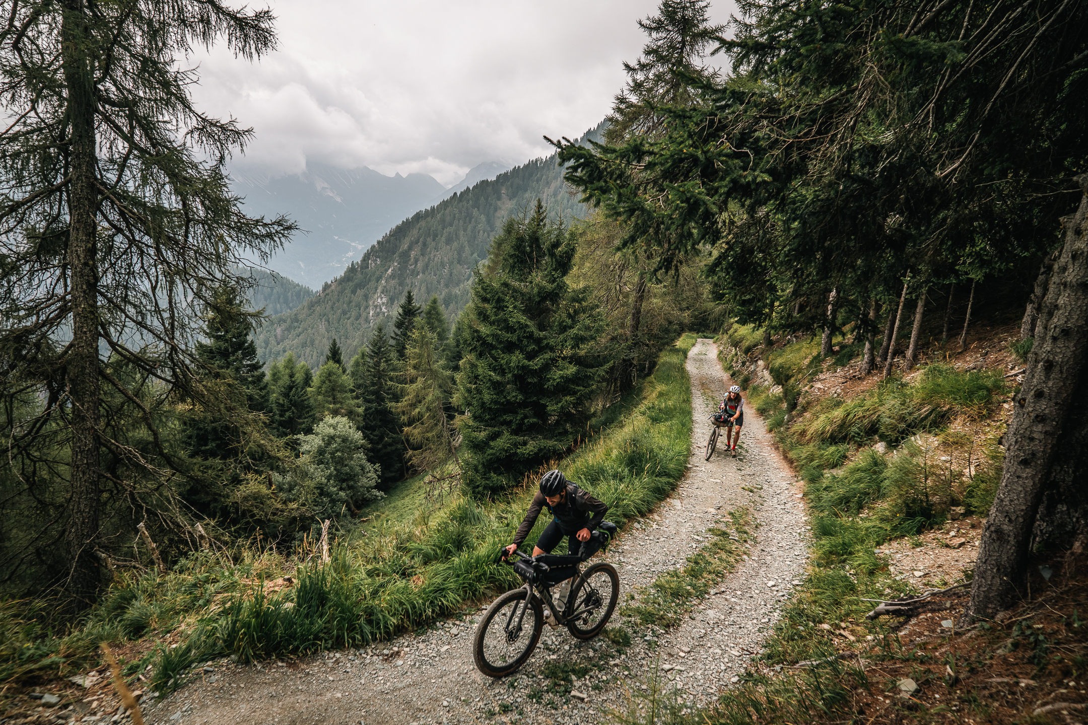 Pushing bikes up a mountain